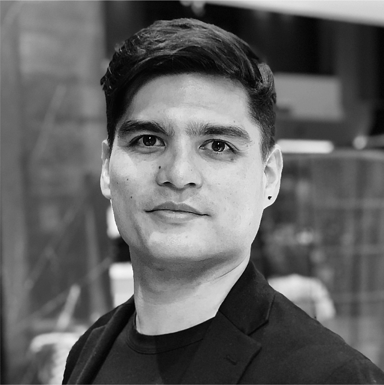 A black and white photo of a man in a suit.